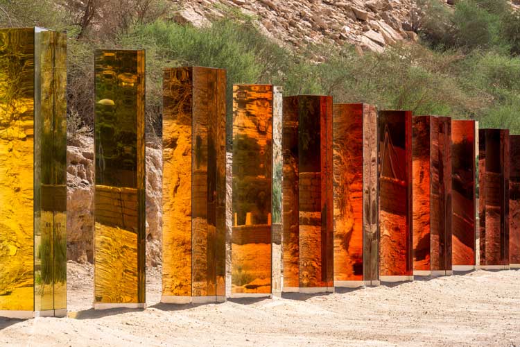 Sabine Marcelis, Light Horizon, installation view, Noor Riyadh 2022. 11 coloured, 2-way mirrored glass columns. Photo: Ruben P Bescos.