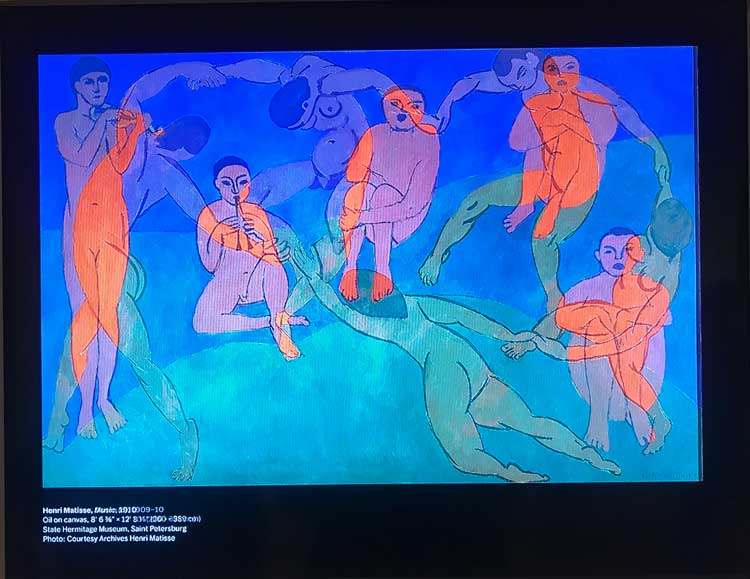 Overlapping digital images on screen of Dance II (1909-1910), Oil on canvas, 260 x 391cm and Music, 1910, Oil on canvas, 260 x 389cm, State Hermitage Museum, Saint Petersburg, Courtesy of Henri Matisse Archives. Installation view photo: Marie Pohl.