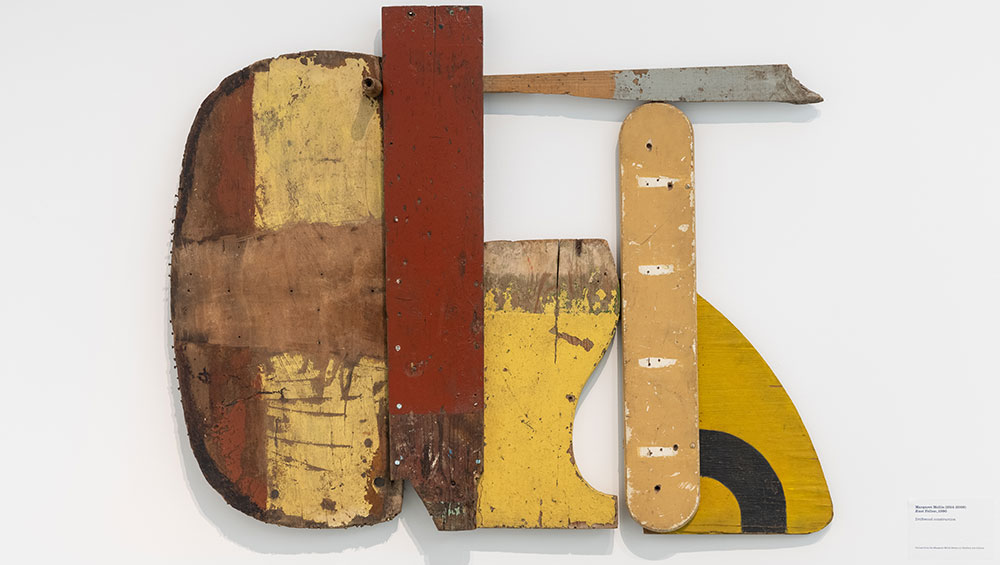Margaret Mellis, Rust Yellow, 1990. Driftwood construction, 89 x 110 cm. Installation view, Towner Art Gallery, 2021.