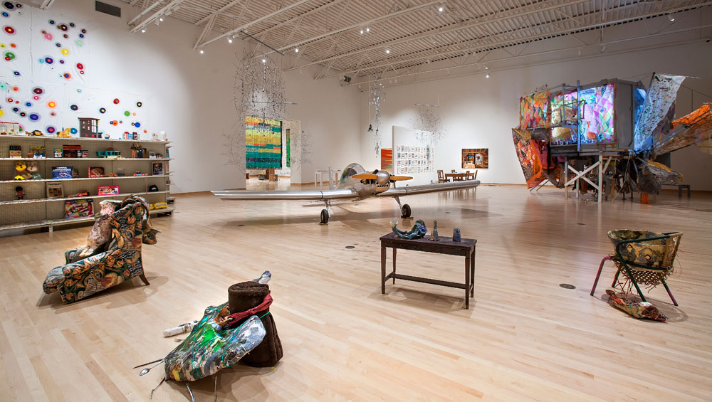 Makeshift, gallery view, 2018. Foreground: Brad Kahlhamer and Cleo Kahlhamer, Super Catcher/Ultra Cruiser. Background (left to right): Odili Donald Odita, Panic; Alison Elizabeth Taylor, Shed Bed Chain Link Forest Scorpion Sunrise; Greg Smith, TINA (There Is No Alternative).