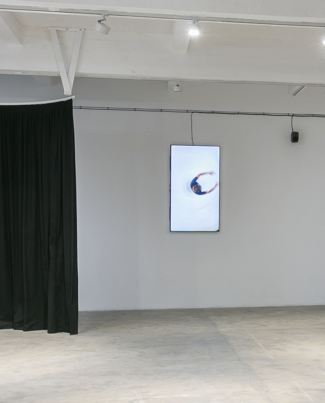 Screen showing Paul Maheke dancing, installation view, Chisenhale Gallery, 2018.