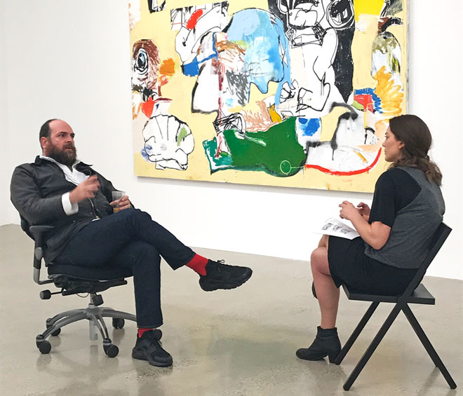 Eddie Martinez talking to Studio International at the opening of Cowboy Town at Timothy Taylor Gallery, London, April 2017. Photograph: Martin Kennedy.