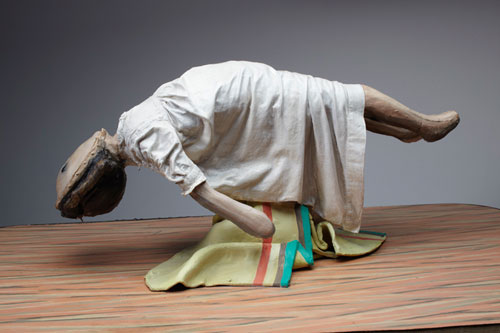 Cathie Pilkington. Levitating Doll, 2010. Wood, steel, clay, fabric, lino, paint 28 x 90 x 52 cm. © the artist and Space Station Sixty-Five. Photo: Graham Challifour.