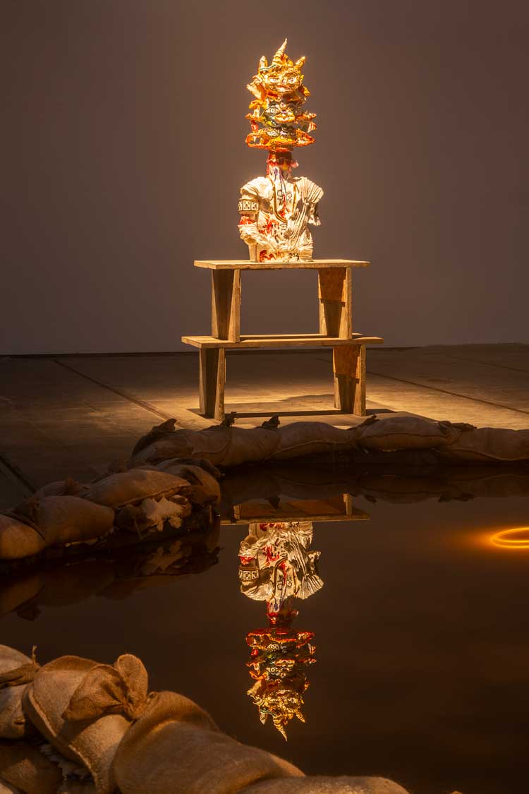 Ramesh Mario Nithiyendran. Multiheaded Figure in Drapery (King), 2023. Glazed ceramic beads, fabric, 159 x 63 x 63 cm. Photo courtesy Tramway.