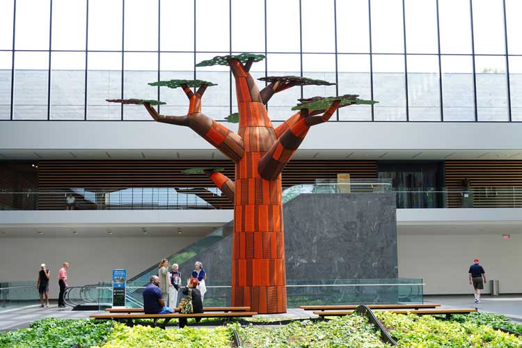 Emeka Ogboh, Ámà: the gathering place, 2019. Multimedia installation (sound, sculpture, and fabrics). Installation view, the Ames family Atrium, Cleveland Museum of Art. Copyright the artist.