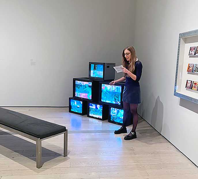Casey Kauffmann with her work It's Over Bitch, at Digital Witness: Revolutions in Design, Photography and Film, Los Angeles County Museum. Photo: Jill Spalding.
