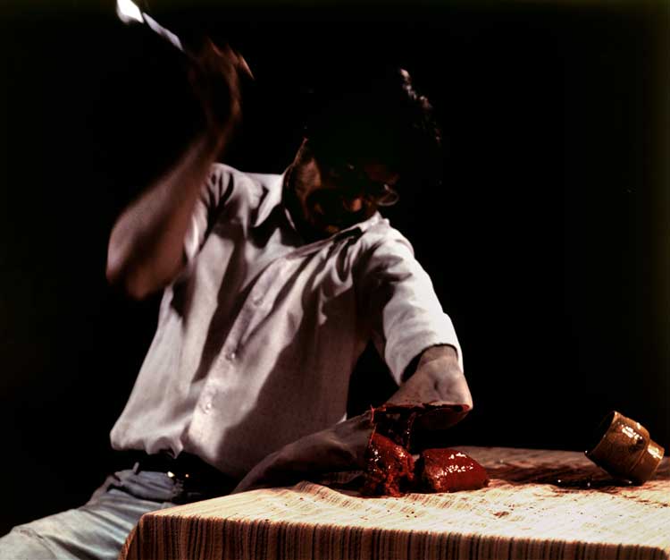Mike Parr. Cathartic Action: Social Gestus no 5 (The Armchop). Performed at Sculpture Centre, The Rocks, Sydney, 1977. Photo: John Delacour.