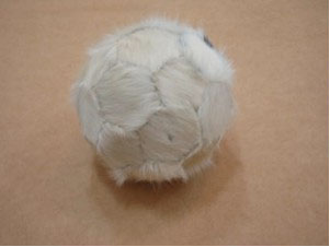 Felipe Barbosa. 
        Boi Bola, /[Ox Ball], 2006.

 Ball made from leather from oxen marked with hot iron. 
Courtesy Felipe Barbosa.