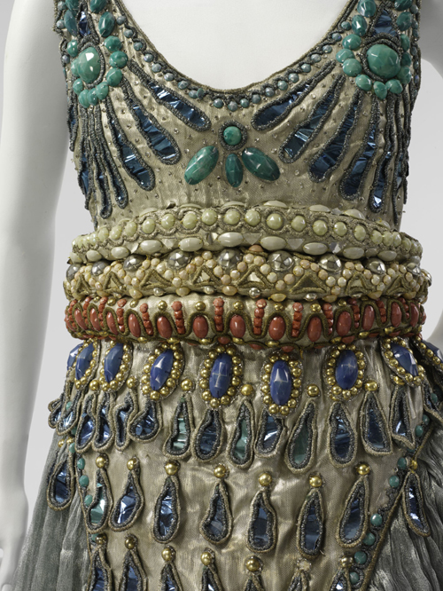 Paul Poiret (French, 1879-1944). Fancy Dress Costume, 1911. Seafoam green silk gauze, silver lamé, blue foil and blue and silver coiled cellophane cord appliqué, and blue, silver, coral, pink, and turquoise cellulose beading. The Metropolitan Museum of Art, Purchase, Irene Lewisohn Bequest, 1983