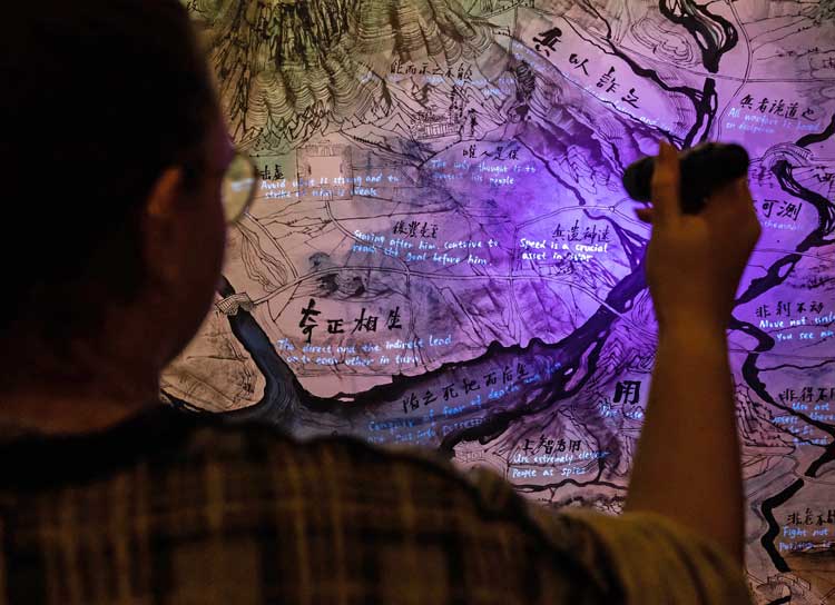 Qiu Zhijie. Map highlighted with UV torch. Photo: Tom Denman.