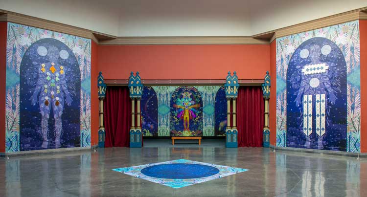 Saya Woolfalk. We Emerge at the Sunset of Your Ideology, 2022. (installation detail view). Multimedia installation, four figures: glass and digital collage vinyl mural, 214 x 145 inches each. 2 single-channel colour videos, infinite loop with sound. Pennsylvania Academy of the Fine Arts. Photo: Lori Waselchuk.