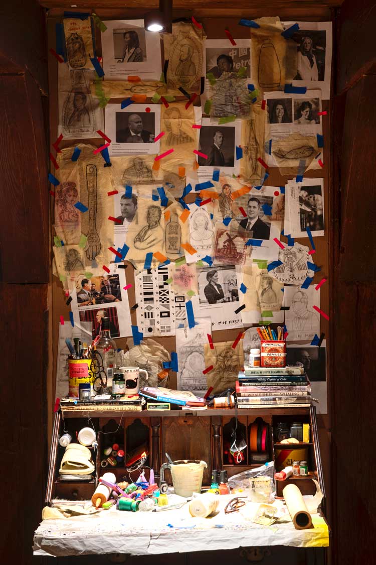 Duke Riley, Installation view of writing desk inside historical home, in DEATH TO THE LIVING, Long Live Trash, Brooklyn Museum, 2022-23. Photo: Danny Perez.