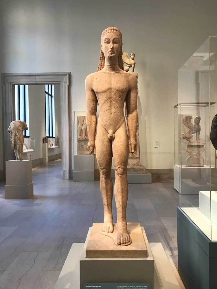 Forward Momentum, marble statue of a Kouros, Greek, c590-580 BC. Stone sculpture, 194.6 × 51.6 × 63.2 cm. Fletscher Fund, 1932. Metropolitan Museum of Art New York.