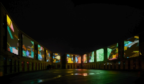 Clifford Ross. Nighttime view of immersive Harmonium Mountain video. Courtyard D. MASS MoCA.