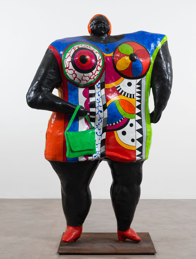 Niki de Saint Phalle, Big Lady (Black), 1968/1995. Painted polyester, pen, metal base, (47 x 157 x 80 cm (97 1/4 x 61 3/4 x 31 1/2 in). Installation view, Hauser & Wirth Somerset, 2025. © Niki Charitable Art Foundation. All Rights Reserved, DACS 2025. © Jean Tinguely, DACS 2025. Photo: Ken Adlard. Courtesy the artists and Hauser & Wirth.