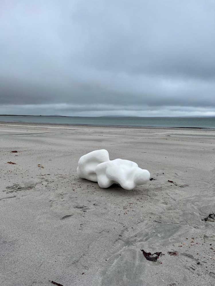 Mella Shaw.Sounding Line Sculpture on South Uist beach, 2023 Whalebone, clay. Photo © Mella Shaw.