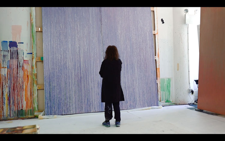 Pat Steir standing in front of Lila Judith, 2016–17. Photo courtesy Pat Steir and Veronica Gonzalez Peña.