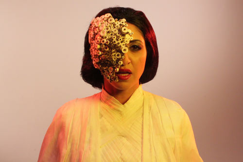 MASK (played by Houda Echouafni) giving orders to the aliens.