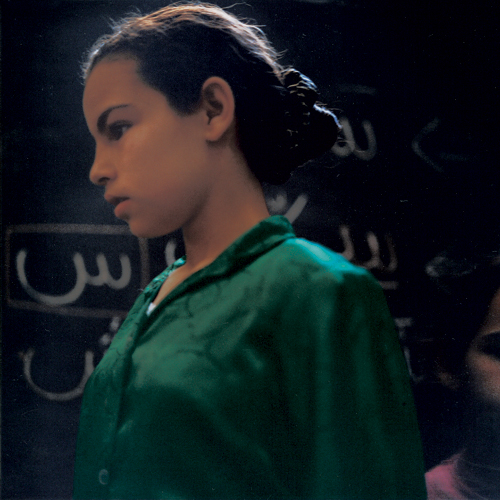 Yto Barrada. Meriem - A spelling class at the Darna day centre for street children, Tangier 1999, from the series A Life Full of Holes: The Strait Project, 1998-2004. C-print © Yto Barrada. Courtesy of Galerie Polaris and the artist.
