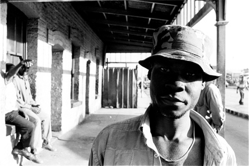 Luis Basto. Bus Stop, Old Harare, 2001. Fibre-based photographic print, 15.6 x 19.5 in. (40 x 50 cm) © Luis Basto. Courtesy of the artist.
