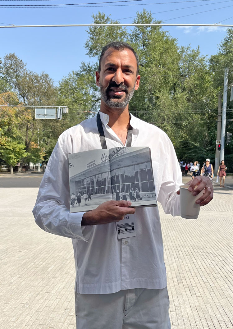 Asif Khan stands in front of the new facade showing picture of original cinema frontage. Photo: Veronica Simpson.