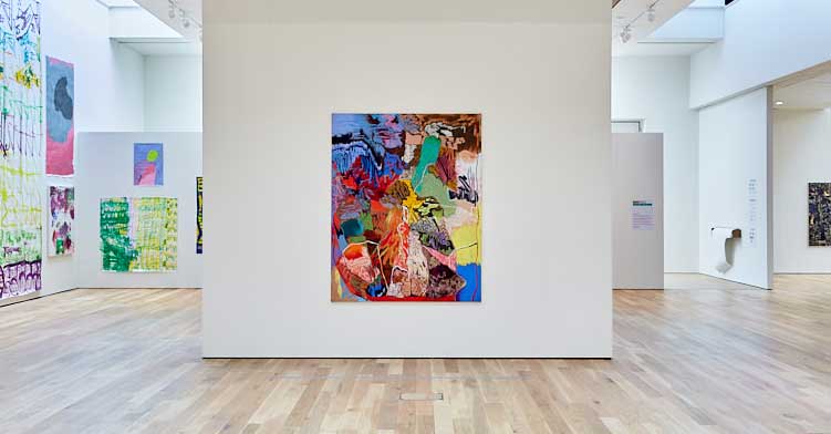 Centre: Rachel Jones, Lick your teeth, they so clutch, 2021. Oil pastel, oil stick on canvas, 159.5 x 199 cm. Installation view, The Reason for Painting, Mead Gallery, Warwick Arts Centre, 2023. Photo: Luke Pickering.