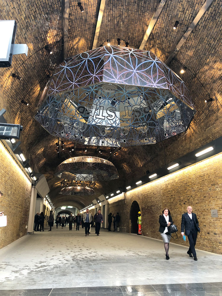 Mark Titchner. Me. Here. Now., 2018. Digital print on polished stainless steel. Installation view, London Bridge Station.