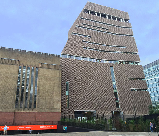 View across the River Thames to Tate Modern Boiler House and Switch House, with adjacent Rogers Stirk Harbour + Partners-designed apartments, Neo Bankside.