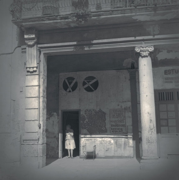 Alexey Titarenko. Woman in Doorway, Havana, 2003. Gelatin silver print, printed by the artist, edition 1/5, 10 3/4 x 10 7/8 in (27.3 x 27.6 cm).