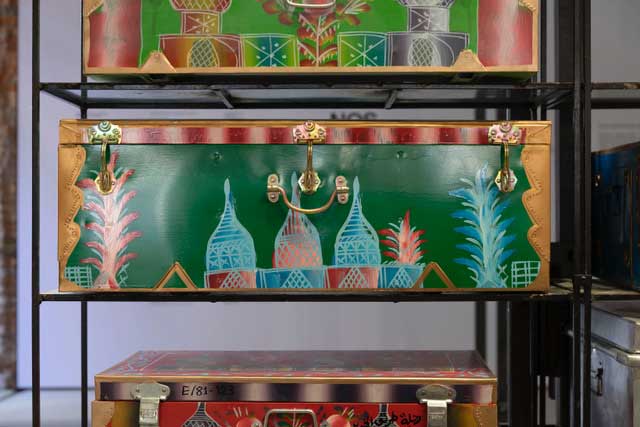 Stacked metal chests. Abdullah Al Saadi: Sites of Memory, Sites of Amnesia. Image Courtesy of National Pavilion UAE, Venice Biennale 2024. Photo: Ismail Noor of Seeing Things.