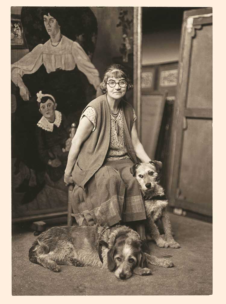 Suzanne Valadon surrounded by two dogs, c1930. Photographic print. Centre Pompidou, Bibliothèque Kandinsky. Credit: Centre Pompidou, MNAM-CCI/Philippe Migeat/ Dist. GrandPalaisRmn.