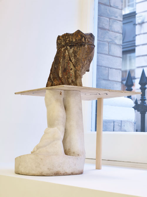 Danh Vō. Your mother sucks cocks in Hell, 2015. Marble fragment of a child, Roman workshop, 1st-2nd century AD; oak and polychrome Madonna and child, French Early Gothic; plywood 53.3 x 39.6 x 35.1 cm. Courtesy the Artist and Marian Goodman Gallery. Copyright Danh Vō.