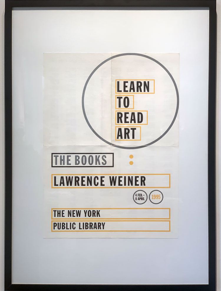 Poster for Lawrence Weiner's exhibition Learn to Read Art: The Books at the New York Public Library, New York, 4 February – 8 April 1995. Installation view, Art & The Book at The Warburg Institute, London, 22 May – 2 August 2025. Photo: Bronac Ferran.