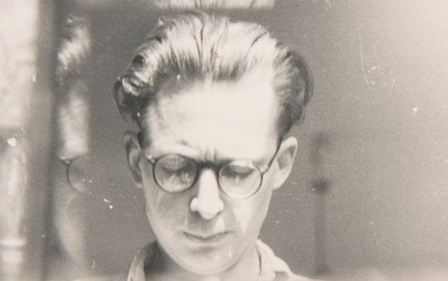 Andrzej Wróblewski, [Self-Portrait with Glass Reflection], undated. Black and white photograph, 5.2 x 8.4 cm. Archive of the Artist’s Heirs. © Andrzej Wróblewski Foundation.