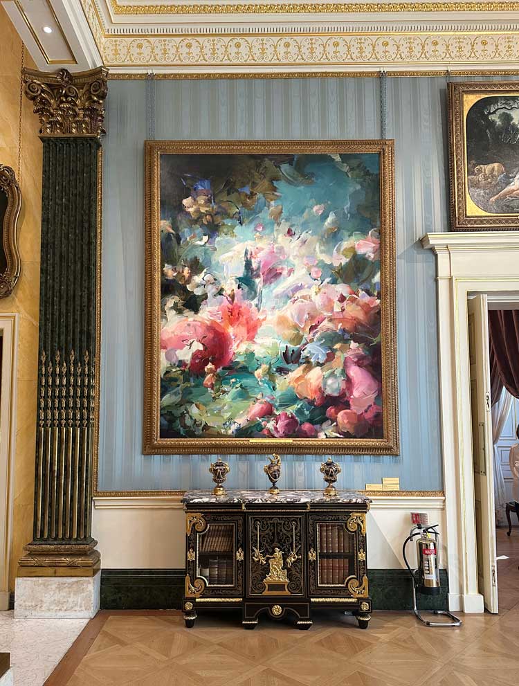 Installation view of Flora Yukhnovich's painting Folies Bergère, 2024, Wallace Collection, London. Photo: Martin Kennedy.