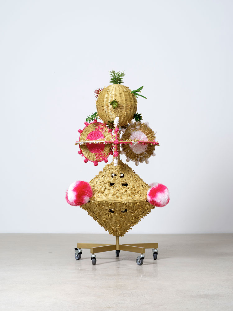 Haegue Yang. The Intermediate – Airflow of Pyramid Winnow, 2015. Artificial straw, powder-coated steel frame, casters, plastic raffia string, artificial plants, 180 x 95 x 95 cm. Courtesy of Galerie Barbara Wien, Berlin. Photo: Sang Tae Kim.